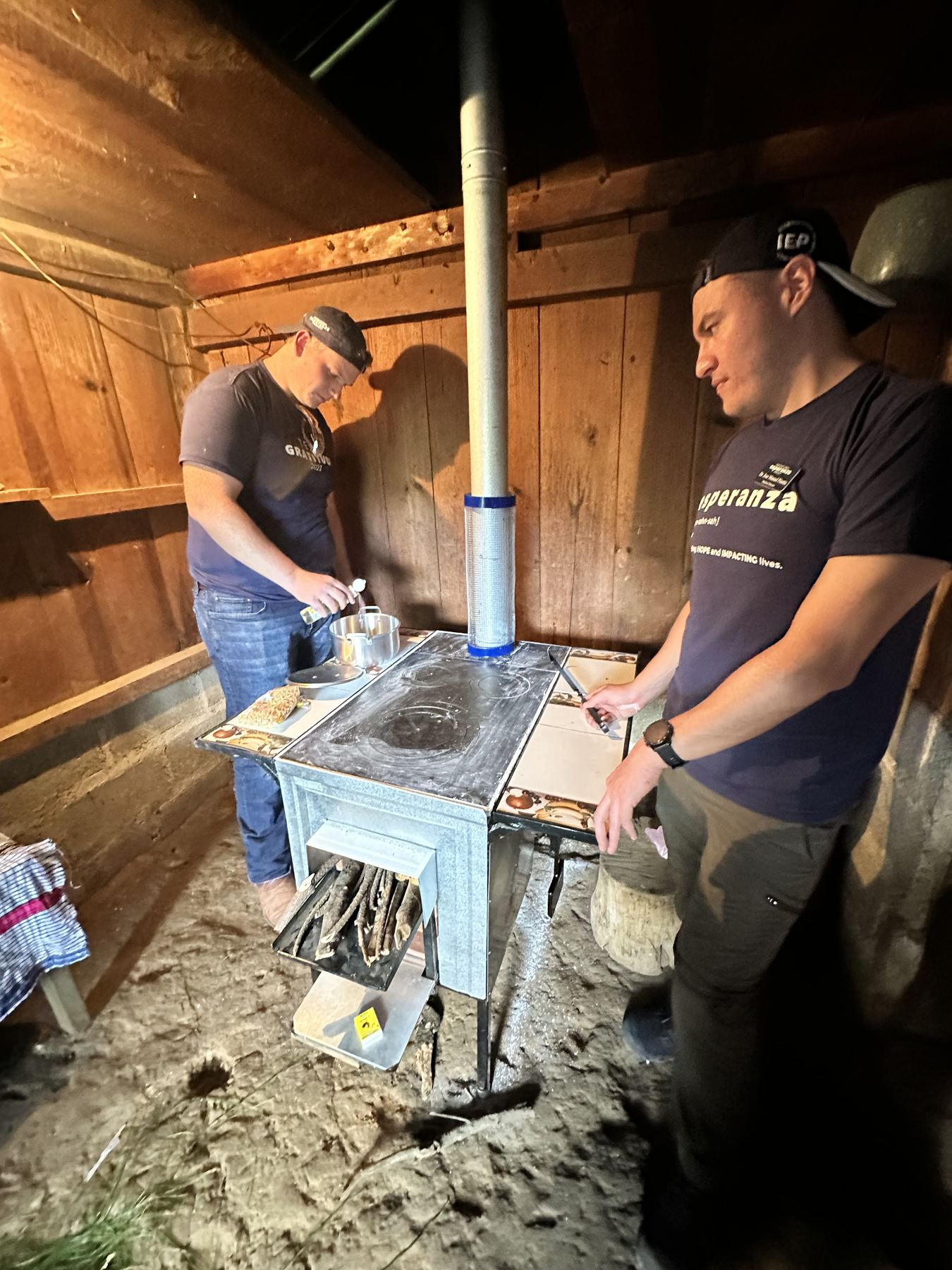 Volunteers installing a wood-burning stove in a rural Guatemalan home
