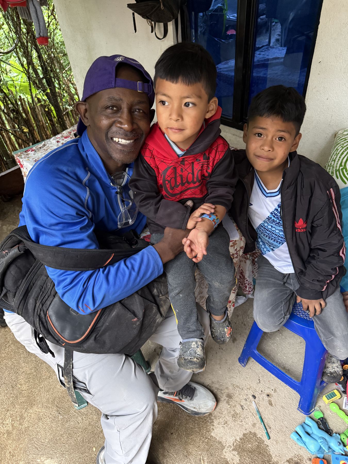 A volunteer sharing a laugh with children in the community