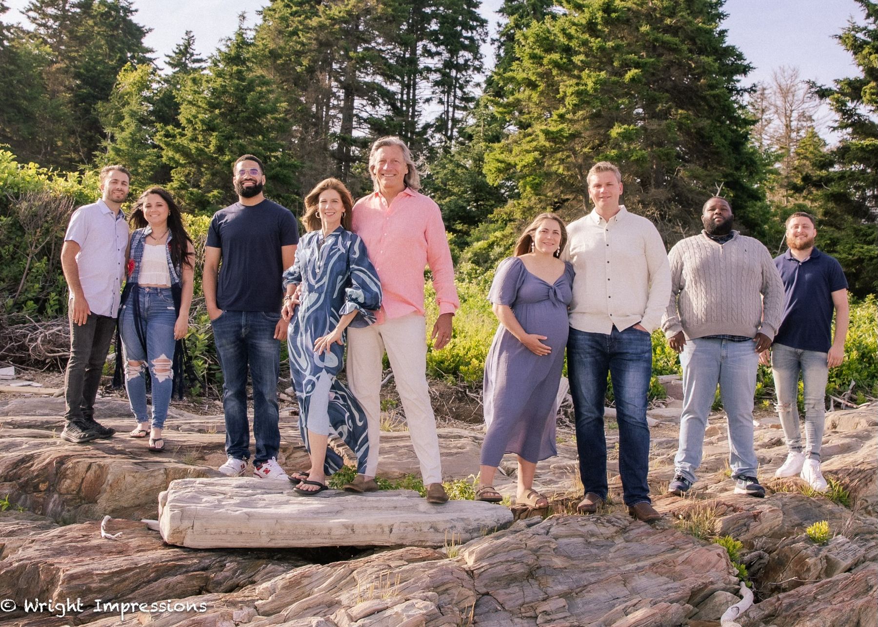 The family on the rocky shore of Bailey Island, Maine